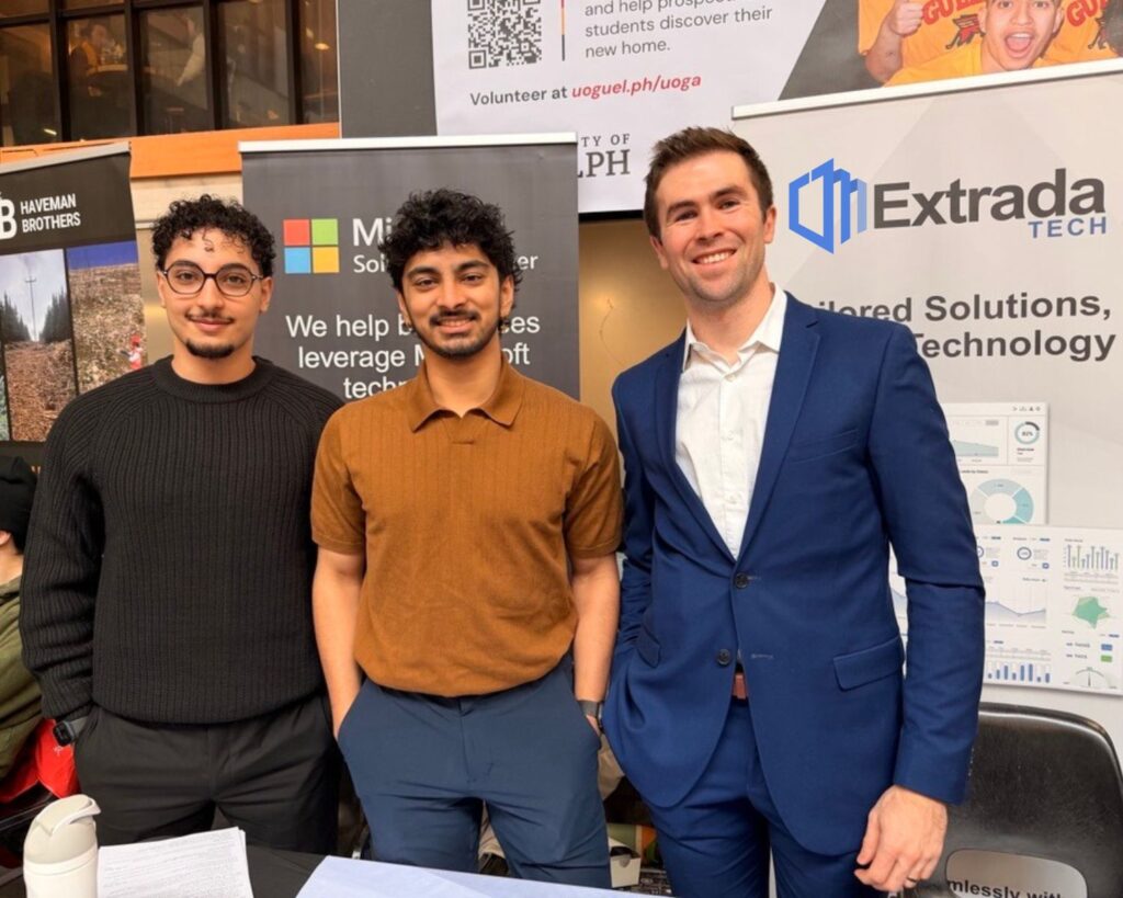Extrada Tech Team members at event in Guelph